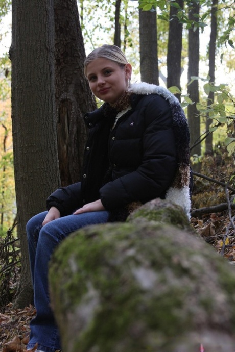 Adorable babe Lil Candy stripping in the forest and showing her puffy pussy