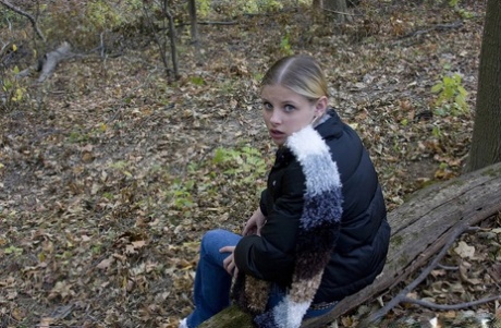 Adorable babe Lil Candy stripping in the forest and showing her puffy pussy