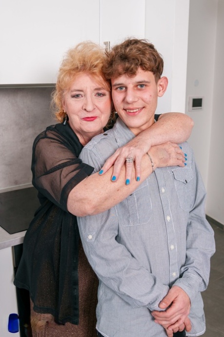 Slutty amateur granny Noretta seduces and screws a young boy in the kitchen